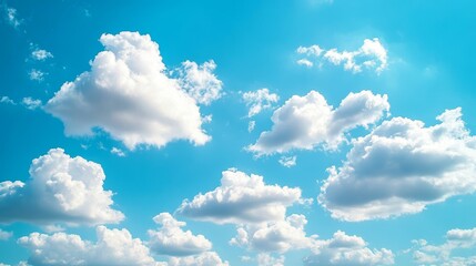Poster - Fluffy white clouds drift peacefully across the bright blue sky, creating a serene and picturesque scene of white clouds against a vibrant blue sky, perfect for capturing the beauty of nature.