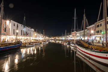 canal in the center of Cesenatico Rimini illuminated by lights at night