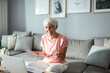 © Marko Geber - Senior woman working on laptop at home