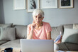 © Marko Geber - Senior woman working on laptop at home