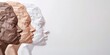 © Olha Yavorska - paper silhouettes of human heads on the side, different skin color, multicultural