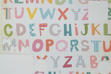 Wall Mural - decorative scrapbooking paper with primary alphabet and cutouts