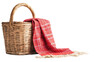 © Subin - A woven basket with a red plaid blanket draped over the side, perfect for picnics or cozy outings, combining nature and comfort in one image.