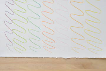 Wall Mural - wavy lines on paper with torn edge and wood`