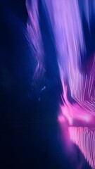 Wall Mural - a vibrant display of colorful lights creates an abstract image, with swirling pink and purple tones 
