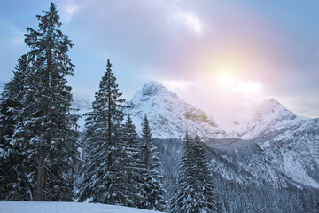 Wall Mural - winter landscape with sunset and alpine mountains
