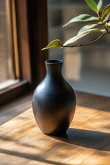 Canvas Print - Black Vase on Wooden Table