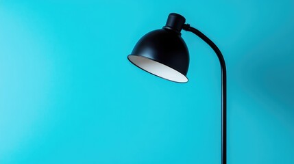 Leinwandbilder - Modern black floor lamp against a vibrant turquoise background with ample copy space for text placement