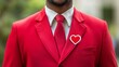 © Tobi - Confident professional in vibrant red attire showcasing a heart-shaped name badge during a corporate event