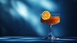 © Irina Kozel - A stylish cocktail in a clear glass garnished with a slice of orange, set against a soft blue background