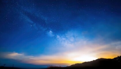 Wall Mural - ethereal nightscape of the milky way and vibrant horizon over misty silhouettes, perfect for cosmic themed design or tranquil wall art