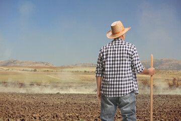 Sticker - Rear view shot of a farmer with a spade