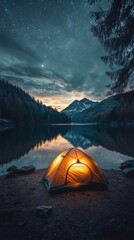 Wall Mural - Cozy tent illuminated by a warm glow beside a tranquil lake at twilight in the wilderness