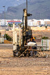 © Lu - A man is working on a machine in a field