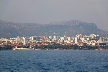 Wall Mural - Contemporary buildings, gardens and beaches at the waterfront in Split, Croatia. View of Split from the boat.