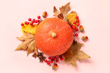 Wall Mural - Autumn composition with ripe pumpkin, berries, acorns and fallen leaves on light background