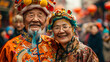 © Marina_Nov - Happy elderly Chinese couple on Dragon Parade with colorful dragons dancing through streets, with participants in traditional costumes. The atmosphere and traditions of Chinese New Year celebrations.