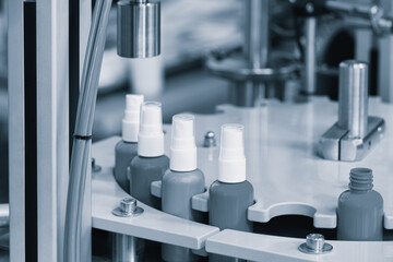 Poster - pharmaceutical industry, medicine pills are filling in the  bottle on production line machine conveyor at the medical factory. selective focus.