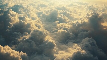 Wall Mural - Majestic Cloudscape Aerial View with Golden Sunlight Illuminating the Fluffy Clouds