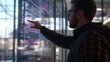 © isrofiyah - Man Analyzing Data on Large Interactive Screen