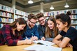 © SimpleDesignStudio - Group of Young Students Collaborating on Study Project in Library - Educational Environment Encouraging Teamwork and Learning
