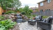 © arsyi_06 - Backyard patio with waterfall, pond, and seating area