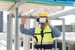 © amorn - Male engineer using virtual reality headset at construction site. Male plumber wearing virtual reality headset for inspecting water pipes network system