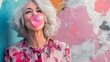 © Berkah - Mature Woman Blowing Pink Bubblegum Against Colorful Wall
