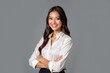 © SimpleDesignStudio - Confident Young Professional Woman in a White Shirt Posing with Crossed Arms on a Plain Gray Background for Corporate and Personal Branding Use