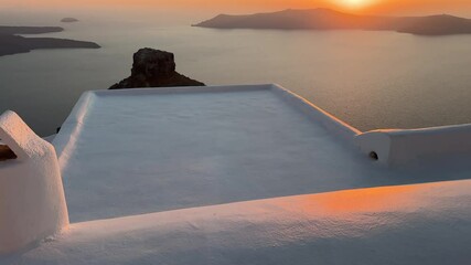 Wall Mural - Beautiful sunset in Santorini island, Greece. White architecture with sea view. Blue sea and the blue sky at sunset. Summer travel and vacation. 
