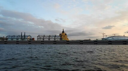 Wall Mural - Nizhny Novgorod, Russia. Spit of Nizhny Novgorod. Cathedral of the Holy Blessed Prince Alexander Nevsky. Warehouses. Sunset Time