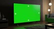 © Mahbub - A large TV with a green screen dominates a dimly lit living room, perfect for showcasing your video content or streaming service