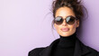 © siraphol - Stylish woman wearing sunglasses against purple background, exuding confidence