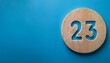 © Rendy Dastian - Banner number 23 on blue background, copy space. Generated image