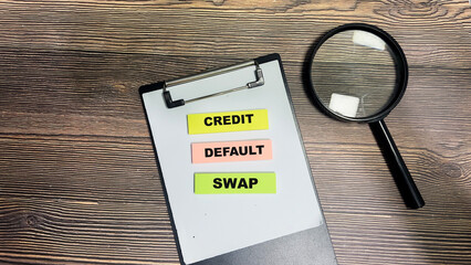 Wall Mural - Concept of Credit Default Swap write on sticky notes isolated on Wooden Table.