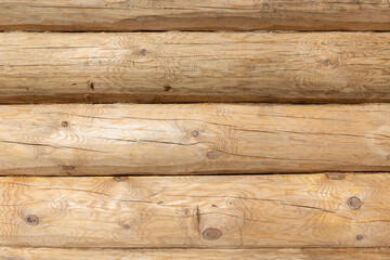 Wall Mural - New wooden wall made of uncolored natural pine tree logs, front view