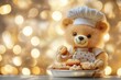 © Tang - Cute teddy bear chef holding cookies with festive bokeh background