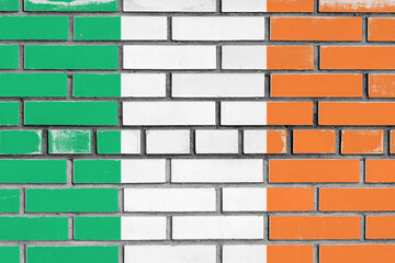 Wall Mural - ireland flag painted over bricks wall