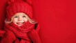 © Wall - A little girl wearing a red hat and scarf