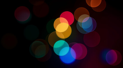 Wall Mural - colorful bokeh circles on dark background. abstract blurred lights, festive overlay for design, holi