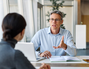 Wall Mural - business meeting businesswoman woman office entrepreneur teamwork colleague businessman man businessperson startup creative  woman smart sitting latina black mid aged