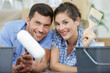 © auremar - couple in new flat prepare to paint walls