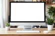 © Pixels Hunter - Blank computer screen mockup on a wooden desk with plants and accessories in a cozy home office setting.