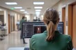 © Atlas Studio - Focused employee working on computer in a modern office environment during business hours