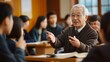 © Thavesak - Wise East Asian Professor Leading Philosophy Class in Traditional College Classroom