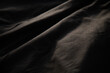 © Egor - Dark fabric texture with subtle folds and shadows, creating a dramatic and moody aesthetic. Perfect for backgrounds or design elements.
