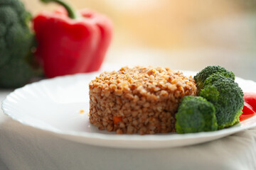 Wall Mural - Healthy buckwheat meal with broccoli and bell pepper.  A nutritious and delicious food photography.