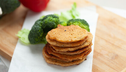 Wall Mural - Stack of savory pancakes served with steamed broccoli. A healthy and delicious meal option.