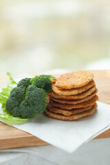 Wall Mural - Stack of savory pancakes with fresh broccoli. Healthy and delicious meal.