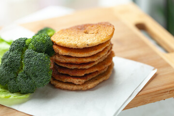 Wall Mural - Stack of savory pancakes with fresh broccoli. Healthy and delicious meal or snack.